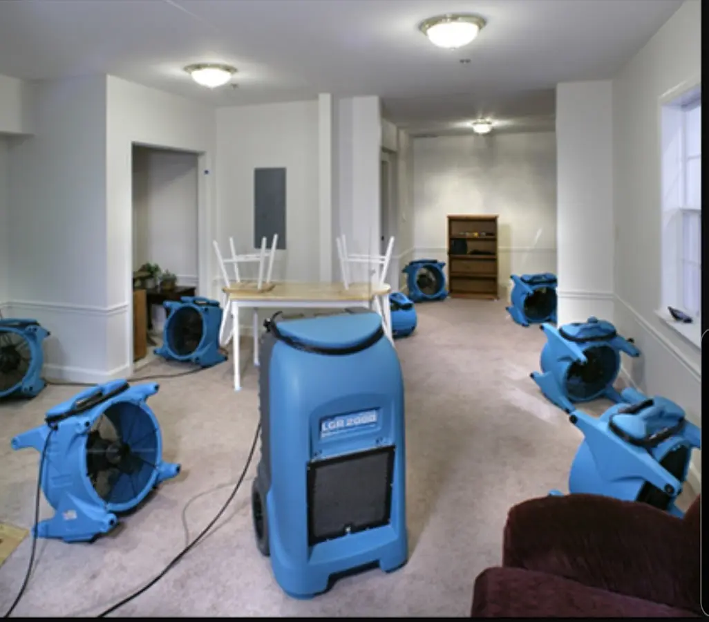 Air movers and dehumidifier setup for Water Damage Restoration in Frederick